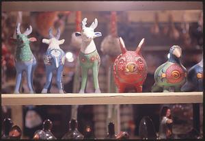 Row of animal figurines on a shelf