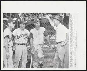 Batting Cage Conference--Three long ball hitters of the league leading Los Angeles Dodgers talk things over with Manager Walter Alston during special batting practice at Busch stadium today. The players are (left to right) Wally Moon, Duke Snider and Gil Hodges. The Dodgers will play two games with the Cardinals the first Tuesday and the second Wednesday night.