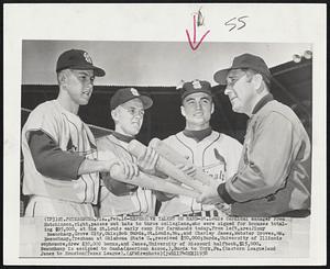 Expensive Talent on Hand- St. Louis Cardinal manager Fred Hutchinson, right, passes out bats to three collegians, who were signed for bonuses totaling $95,000, at the St. Louis early camp for farmhands today. From left; are: Jimmy Beauchamp, Grove City, Okla; Bob Burda, St; Louis, Mo., and Charley James, Webster Groves, Mo. Beauchamp, freshman at Oklahoma State U., received $50,000; Burda, University of Illinois sophomore, drew $30,000 bonus, and James, University of Missouri halfback, $15,000. Beauchamp is assigned to Omaha (American Assoc.),Burda to York, Pa. (Eastern League) and James to Houston (Texas League).