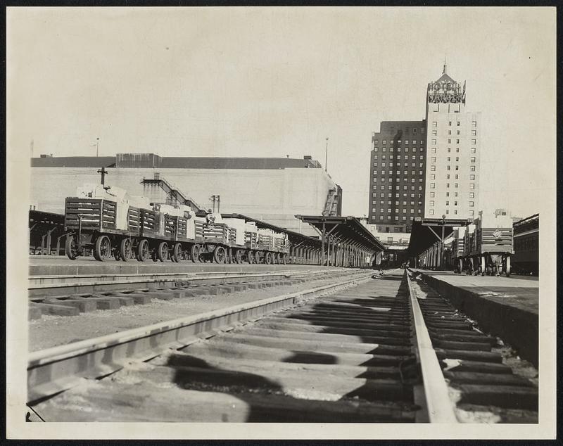 Empty tracks and Railroad Express carts loaded with stuff for Chicago N.Y. but will stay here in Boston.