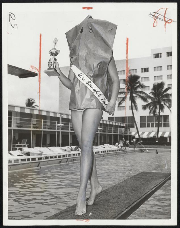 Even With all but her legs hidden, Beverly Rogers is a winner. She won the Miss Beautiful Legs contest at Miami Beach, Fla. For the curious, the rest of Beverly is just as nice as the prize-winners.