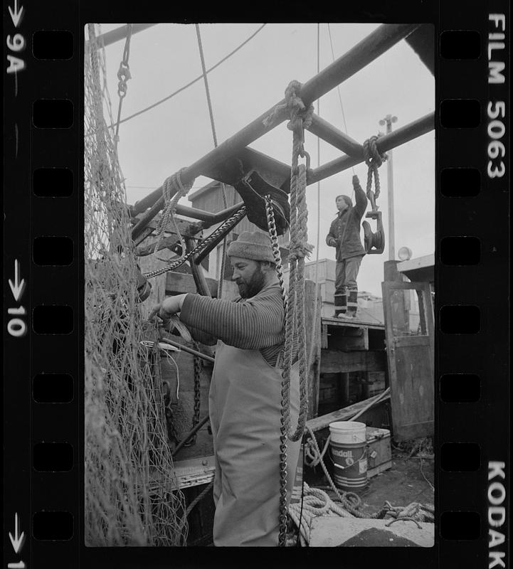 Fisherman fixing a net