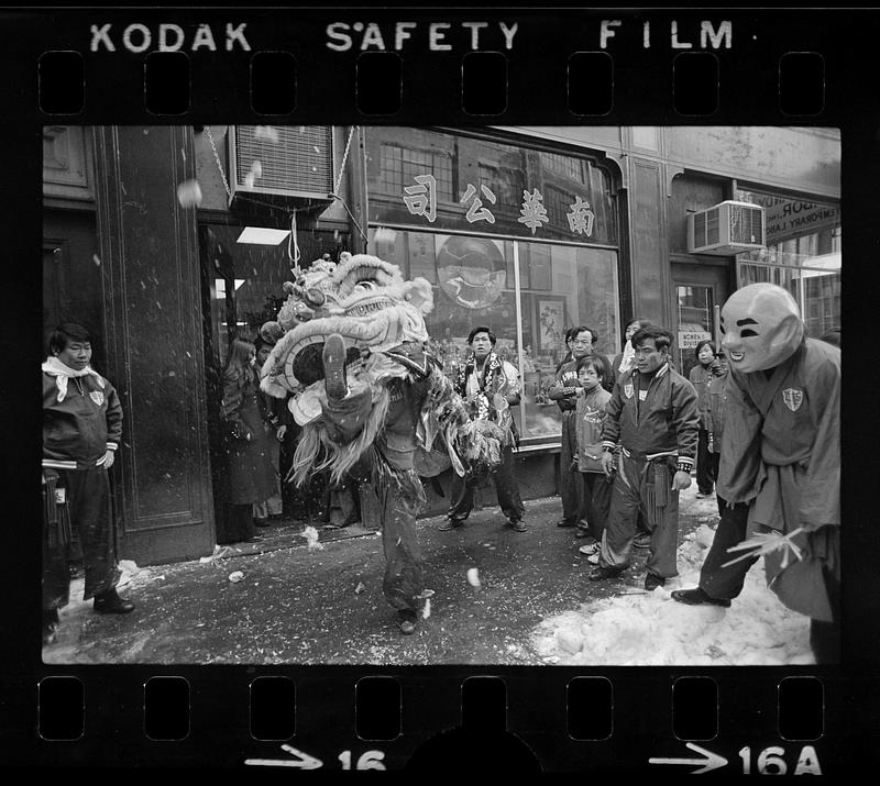 Traditional lion seeks tribute on Chinese New Year, Chinatown, Boston