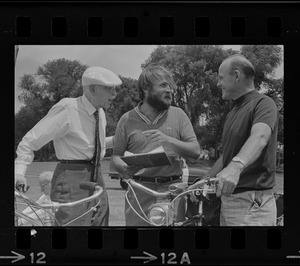 Dr. Paul Dudley White and two unidentified men on Cyclist Day in Boston Common