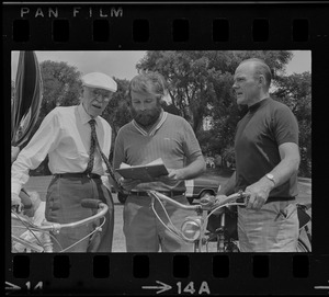 Dr. Paul Dudley White and two unidentified men on Cyclist Day in Boston Common