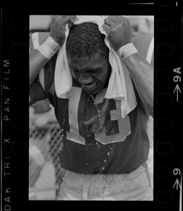 R. C. Gamble, Pats' standout sophomore running back, douses himself with a sopping wet towel to counteract 90 degree temperatures which prevailed during club's intra-squad scrimmage