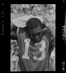 R. C. Gamble, Pats' standout sophomore running back, douses himself with a sopping wet towel to counteract 90 degree temperatures which prevailed during club's intra-squad scrimmage