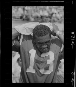 R. C. Gamble, Pats' standout sophomore running back, douses himself with a sopping wet towel to counteract 90 degree temperatures which prevailed during club's intra-squad scrimmage