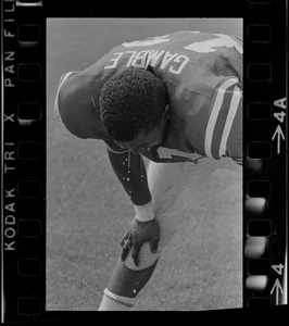 R. C. Gamble, Pats' standout sophomore running back, douses himself with a sopping wet towel to counteract 90 degree temperatures which prevailed during club's intra-squad scrimmage