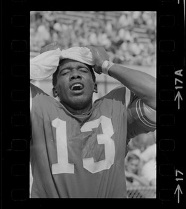 R. C. Gamble, Pats' standout sophomore running back, douses himself with a sopping wet towel to counteract 90 degree temperatures which prevailed during club's intra-squad scrimmage