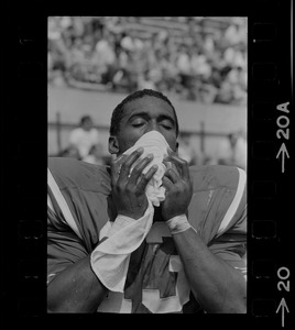 R. C. Gamble, Pats' standout sophomore running back, douses himself with a sopping wet towel to counteract 90 degree temperatures which prevailed during club's intra-squad scrimmage