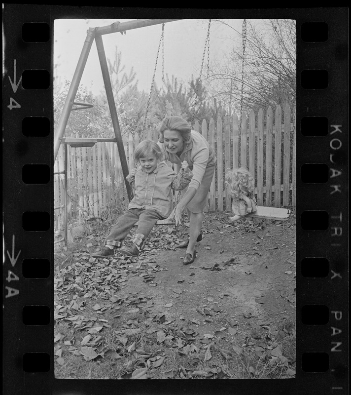 Maggie Bellotti, wife of Francis X. Bellotti, playing with child