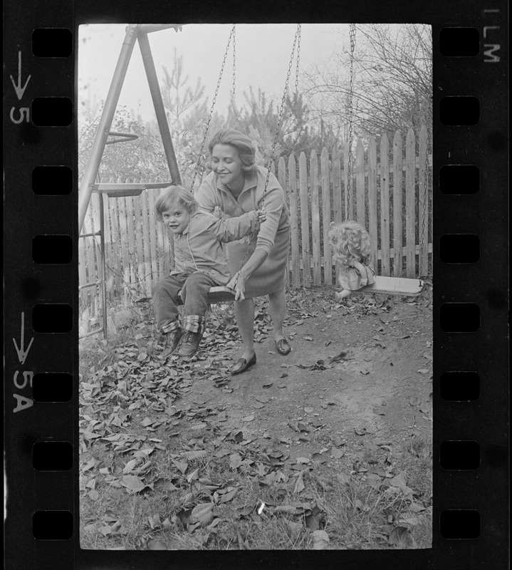 Maggie Bellotti, wife of Francis X. Bellotti, playing with child