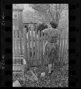 Maggie Bellotti, wife of Francis X. Bellotti, speaking with neighbor