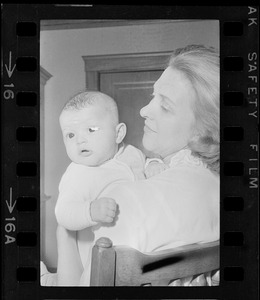 Maggie Bellotti, wife of Francis X. Bellotti, holding baby