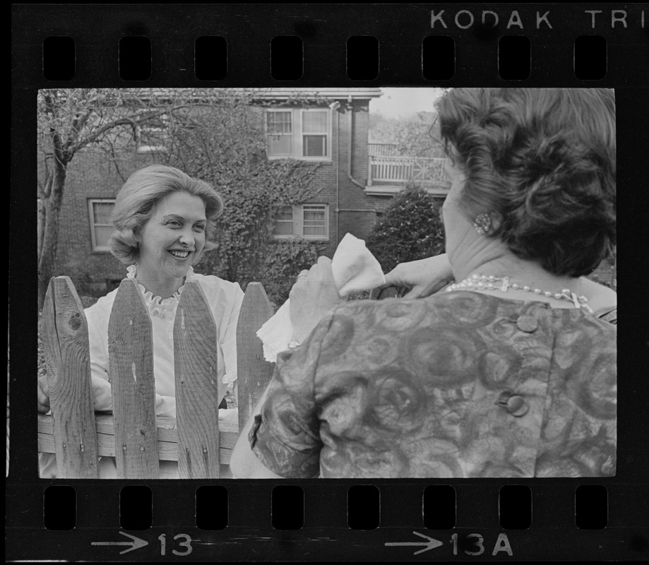 Maggie Bellotti, wife of Francis X. Bellotti, speaking with neighbor