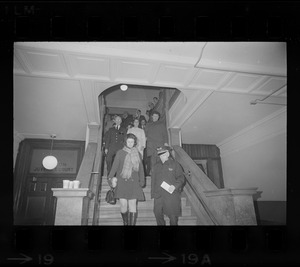 Sara Potter, Janet Bellezia, and Arthur Hurley being led down stairs at Suffolk County Courthouse after being charged with contempt