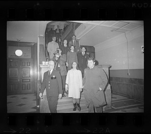 Susan Brennan, Janet Bellezia, and Arthur Hurley being led down stairs at Suffolk County Courthouse after being charged with contempt