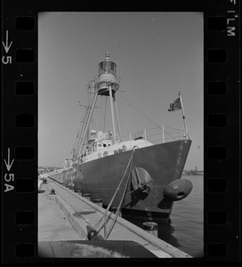 The Ambrose Lightship, for years a fixture at the entrance to New York Harbor, is moored at the Coast Guard base in Boston for refitting