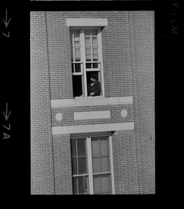 Student sitting in window at Amherst College during building occupation