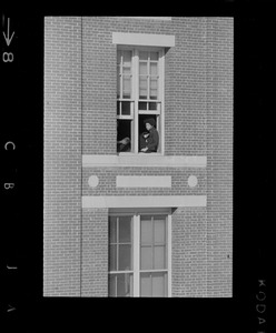 Student sitting in window at Amherst College during building occupation