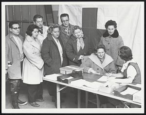 Rita Luane - Red cross worker. Mrs. Jeanne Silva 57 Lynn Ave. as others look on.