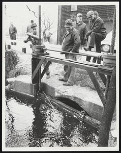 Scituate Town officials open gate at Hunter's Pond.