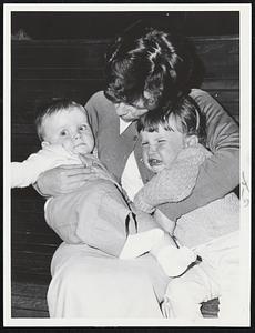 "Bad Old Storm"--That's how two-year-old Elaine Decoursey of Malden felt about it when she was caught at North Station with mother, Mrs. William Decoursey and brother, John, who is eight months old.
