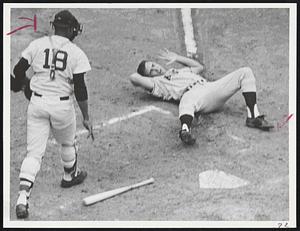Down by Pitch-Angels’ Paul Schaal rolls in pain after he was hit on head by a Jose Santiago pitch in fourth inning of first game yesterday. Elston Howard moves in to assist. Schaal suffered a hairline skull fracture and is now at Sancta Maria Hospital.