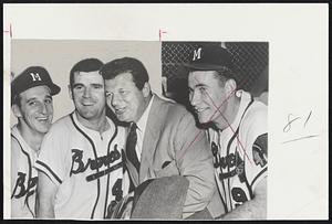 Milwaukee Braves players Warren Spahn, Danny O'Connell, and Joe Adcock, with an unidentified man