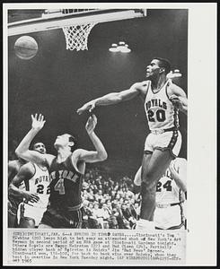 A Spring in Time Saves - Cincinnati's Tom Hawkins (20) leaps high to bat away an attempted shot of New York's Art Heyman in second period of an NBA game at Cincinnati Gardens tonight. Others Royals are Happy Hairston (22) and Bud Olsen (24). Partially hidden player back of Hairston is Knicks' Jim 'Bad News' Barnes. Cincinnati won, 116-102, for back to back wins over Knicks, whom they beat in overtime in New York Tuesday night.