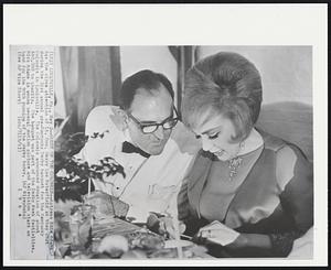 Guest of the Colonels - Actress Edie Adams has the close attention of Lt. Gov. Harry Lee Waterfield as they chat during 31st annual pre-Kentucky Derby banquet for Kentucky Colonels in Louisville. The Colonels announced donation of about $60,000 to charity. The banquet was part of the Derby Week festivities. Miss Adams is among several motion picture and television stars on hand for the 90th running of the derby today.