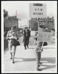 Marching Moppet Youthful Picket Judith O'Brien, 4, of Hyde Park, leads 25 marchers at State House protesting plans for southwest Expressway. They also want cities and towns to retain veto power over highways.