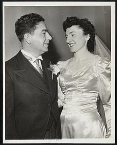 From Braves Field- Charles Sands of Boton (left) assistant Publicity Director for the Boston Braves, is shown with his bride at the reception at Hotel Sheraton. Mrs. Sands is the former Rita Curran of Milton, Mass. They were married in St. Mary's of the Hills, Milton, Mass.