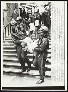 Eugene, Ore. -- Student Arrested -- Members of the Eugene Police department remove a demonstrator from Johnson Hall on the University of Oregon campus late Thursday afternoon. More than 50 students were arrested on trespassing charges. The building was closed and the students refused to leave. Some students had remained in the building Wednesday night protesting the keeping of ROTC on the campus. Demonstrations Antiwar.