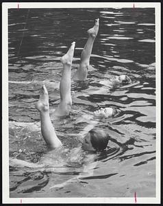 Ballet Leg-Synchronized swimming major perform difficult maneuver at Hanson. Starting at foreground the girls are Margaret Wenzel, 20, of Bedford; Kathryn Guscott, 20, of Westchester, Ill., and Sally Lee Birch, 19, of Westport, Conn.