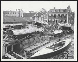 Graves Yard in Marblehead was turned into a graveyard for yachts by the hurricane that battered the historical harbor. Tossed about like toys the yachts were shoved across Graves Marblehead Yacht Yard into the adjoining street.