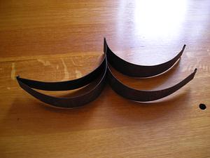Four dark metal strips