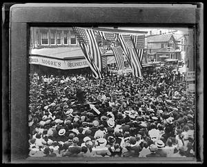 A crowd of people surrounding Theodore Roosevelt