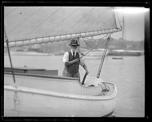 A man sailing a sailboat