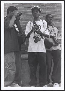 Three young men with cameras