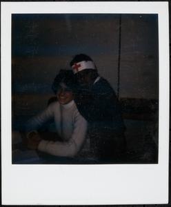 Two people posing and smiling