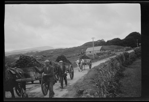 Gortahork, Co. Donegal, Ireland, carting turf, M. Mulhern's garage in the distance