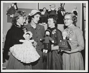 Boston Teen Agers and their winning entries in the Seventeen Magazine doll contest, held recently at Filene's, are congratulated by Terry Thomas, a judge with Carol Denninger and Mary Cauley. Left to right are Judy Ellen Handley of Medford, with a baby doll; Miss Thomas; Celeste Martin of Roxbury, and her fashion doll, and Nancy Mae Richardson of Dover, N.H. whose character doll was modeled on Grandma Moses. These winners are in New York now for national judging of the Seventeen contest. All dolls entered are sent to the Save the Children Federation for Christmas distribution in Europe.