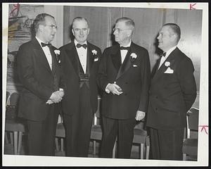 At Brand Names Banquet -- Talking things over before the banquet of the Brand Names Foundation at the Hotel Statler last night were (left to right), Henry E. Abt, president of the Foundation; Michael T. Kelleher, president of the Boston Chamber of Commerce; Edward S. Rogers, chairman of the board of Sterling Drug, Inc., and Harold E. Fellows, president of the Advertising Club of Boston.