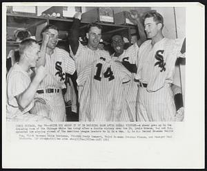 White Sox Whoop it up in Dressing Room After Double Victory--A cheer goes up in the dressing room of the Chicago White Sox today after a double victory over the St. Louis Browns, 5-2 and 8-1, extended the winning streak of the American League leaders to 14 in a row. L. to r.: Second Baseman Nellie Fox, First Baseman Eddie Robinson, Pitcher Randy Gumpert, Third Base Orestes Minoso, and Manager Paul Richards.
