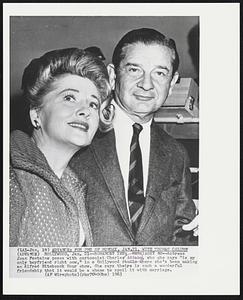 Romance? Yes; Marriage? No--Actress Joan Fontaine poses with cartoonist Charles Addams, who she says "is my only boyfriend right now," in a Hollywood studio where she's been making an Alfred Hitchcock Hour show, She says theirs is such a wonderful friendship that it would be a shame to spoil it with marriage.