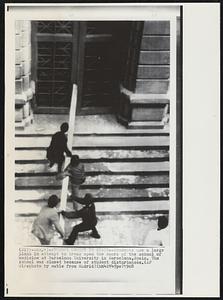 Student Unrest In Spain – Students use a large plank in attempt to break open the doors of the school of medicine at Barcelona University in Barcelona, Spain. The school was closed because of student disturbances.