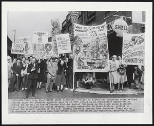 Pickets Greet Vishinsky--Pickets of Slavic and Hungarian organizations display signs and placards opposite pier 90 at 50th street in an anti-Soviet demonstration during the arrival of Soviet Foreign Minister Andrei Vishinsky on the liner Queen Elizabeth here today. Vishinsky and Andrei Gromyko, Russian ambassador to Great Britain, arrived to attend the seventh session of the U.N. General Assembly opening here tomorrow. There was no disturbance as the pickets were held behind police barricades.
