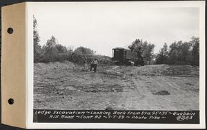 Contract No. 82, Constructing Quabbin Hill Road, Ware, ledge excavation, looking back from Sta. 95+35, Ware, Mass., Jul. 7, 1939